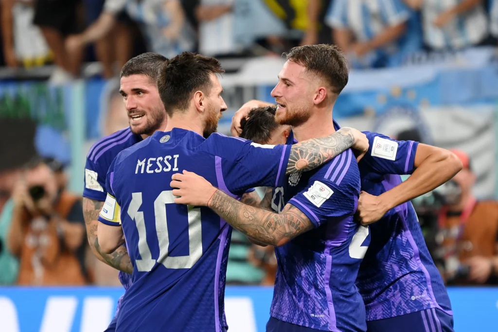 messi and team argentina celebrating on the field