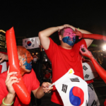 The Red Devils cheer for the Korean team’s match against Uruguay at the 2022 World Cup